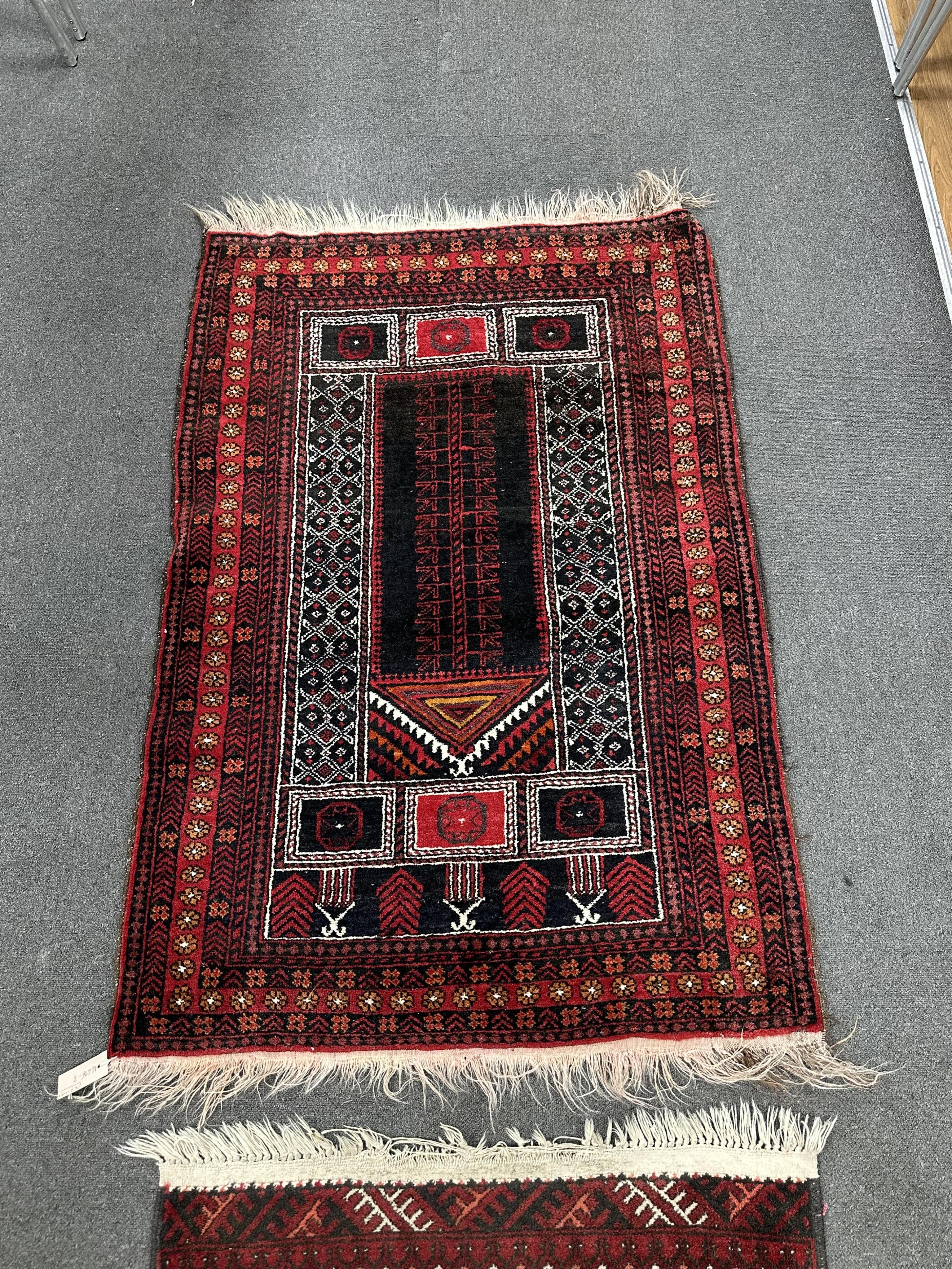 A Belouch prayer rug and Bokhara rug, larger 140cm x 95cm. Condition - fair.